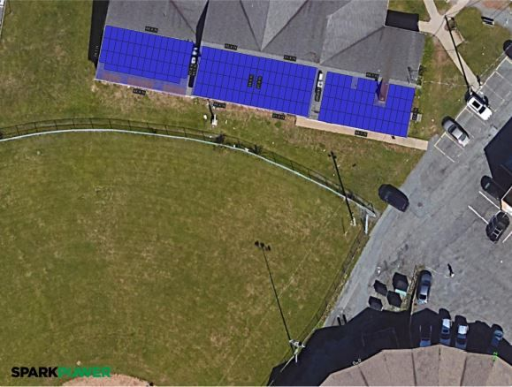 Aerial roof layout with solar panel areas highlighted in blue and Spark Power branding.