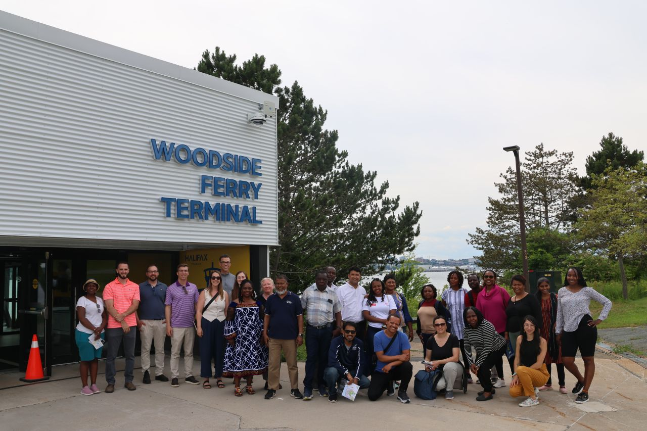 Group of visitors outside Woodside Ferry Terminal.