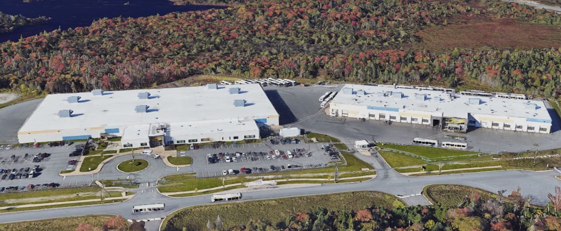 Aerial view of the Ragged Lake bus depot buildings and surrounding bus parking areas.